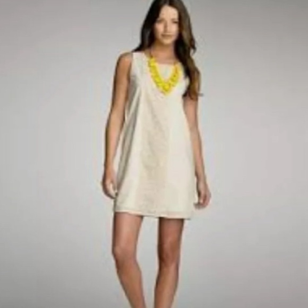 Cream Sleeveless Shift Dress with Yellow Accent Necklace